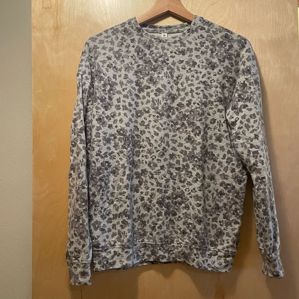 Lightly worn, flower printed, grey athletic sweater with stretch.